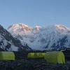 Despite of all my efforts I wasn't successful by catching the alpenglow on the summits of mountains. The sunsets and sunrises always looked like on this photo of Pik Pobeda. 